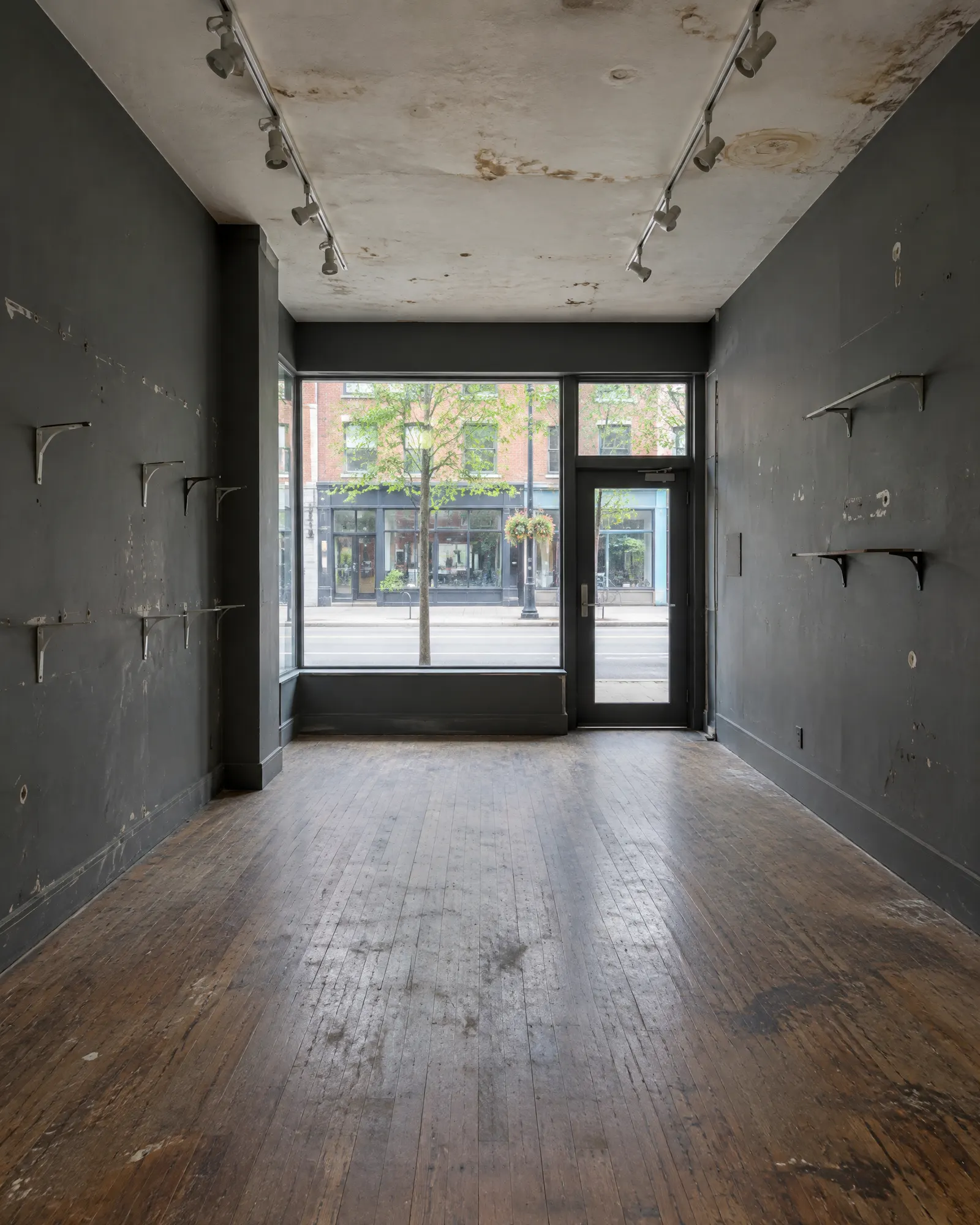 Empty storefront interior, before and after repainting (before)